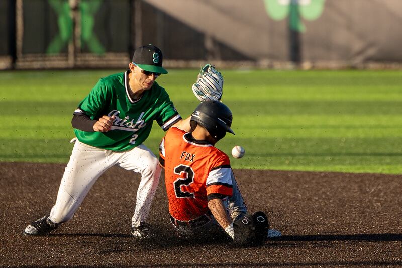 Keegan Murphy (2) of Seneca loses ball whilst Nicholas Fox (2) of Beecher slides into second base on Friday, April 11, 2025 at Seneca High School in Seneca.