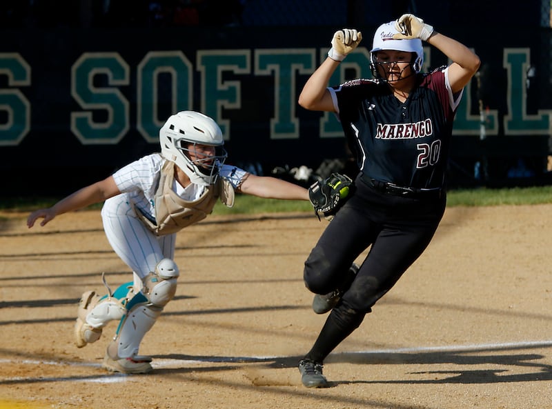 Woodstock North's Kylie Stevens takes out Marengo's Ariana Rodriguez as she tries to score during a Kishwaukee River Conference softball game on Tuesday, April 28 , 2026, at Woodstock North High School.