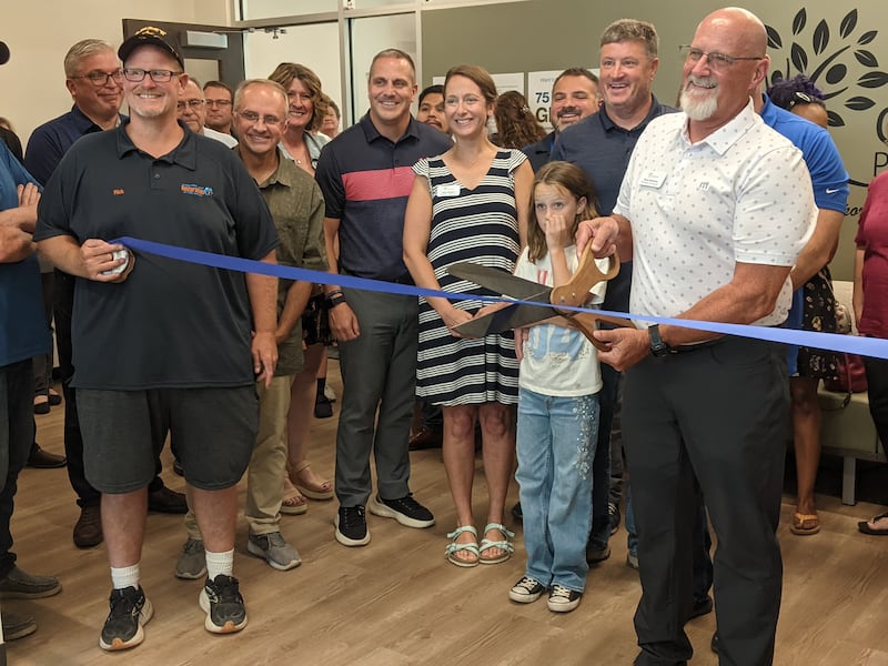 Oswegoland Park Board President Dave Behrens cuts the ribbon during a July 28 ribbon-cutting ceremony for the Oswegoland Park District's Grove Administration & Operations Center at 3220 Grove Road in Oswego.
The ceremony was hosted by the Oswego Area Chamber of Commerce.