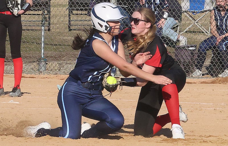 Hall's Caroline Morris tags out Bureau Valley's Gaby Trujillo at second base on Monday, March 9, 2026 at Bureau Valley High School.