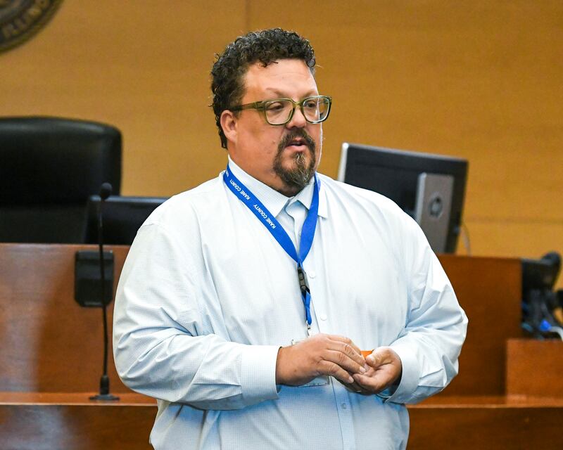 Nate Johnson speaks and gives the graduates of the Veterans Treatment Court graduation ceremony a pin during the ceremony on Monday Sept. 22, 2025, held at the Kane County Judicial Center in St. Charles.