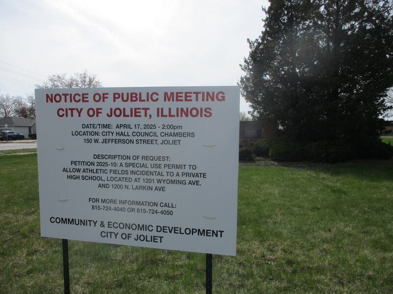 A sign posted by the city of Joliet on the site of the former Our Lady of Angels Retirement Home gives notice of the Zoning Board of Appeals meeting vote on a future athletic facility for Joliet Catholic Academy. April 16, 2025