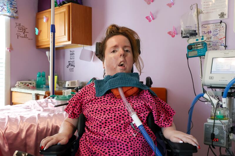 Lauren Gross, 29, who was born with Spinal Muscular Atrophy with a life expectancy of 3-4 years, poses for a photo in her bedroom of her Bradley home last week. Lauren will be celebrating her 30th birthday next Saturday with an open house party at Brookmont Bowling from 1 - 4 p.m.