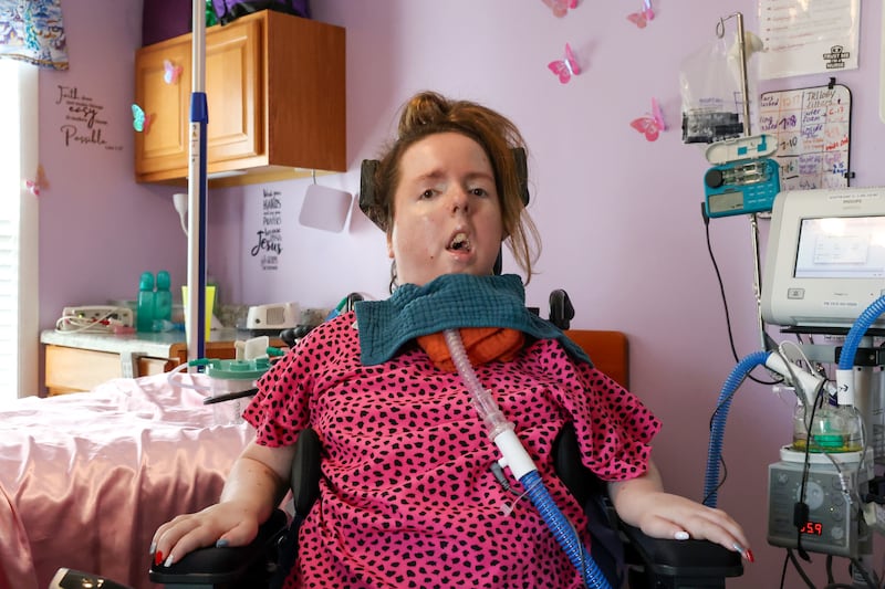 Lauren Gross, 29, who was born with Spinal Muscular Atrophy with a life expectancy of 3-4 years, poses for a photo in her bedroom of her Bradley home last week. Lauren will be celebrating her 30th birthday next Saturday with an open house party at Brookmont Bowling from 1 - 4 p.m.