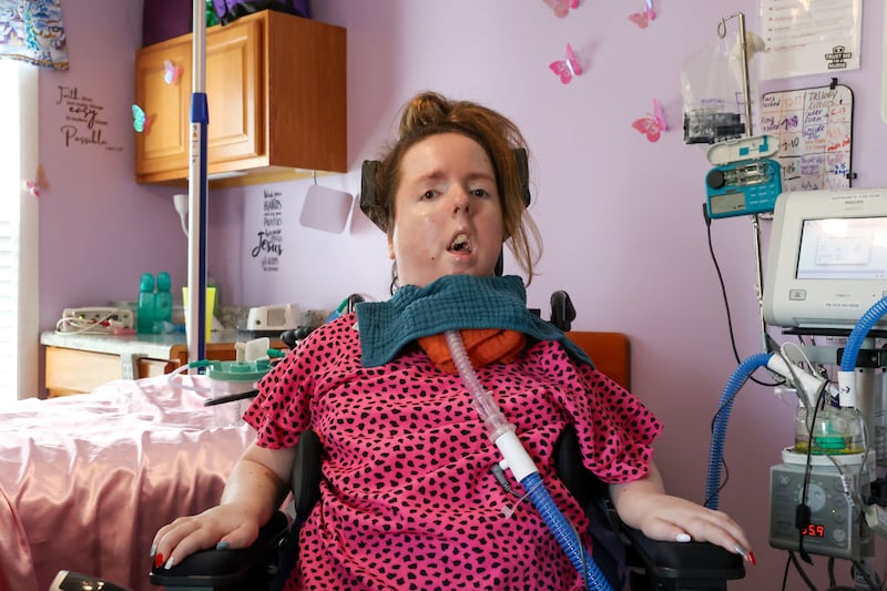 Lauren Gross, 29, who was born with Spinal Muscular Atrophy with a life expectancy of 3-4 years, poses for a photo in her bedroom of her Bradley home last week. Lauren will be celebrating her 30th birthday next Saturday with an open house party at Brookmont Bowling from 1 - 4 p.m.