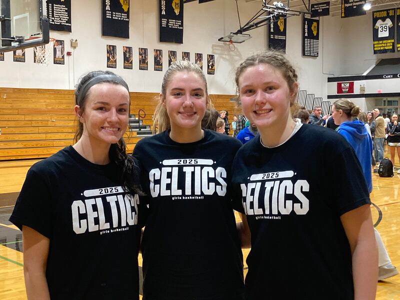 Providence's Catholic's Molly Knight (left), Eilish Raines (center) and Kennady Kotowski.