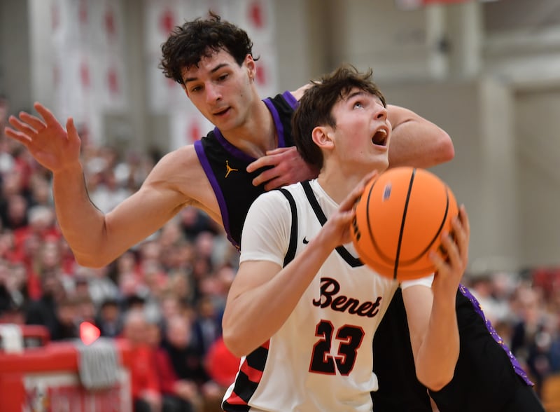 Benet’s Edvardas Stasys (23) goes to the basket as Downers Grove North’s Aidan Akkawi defends during the Class 4A Benet Sectional championship game on March 7, 2025 at Benet Academy in Lisle.