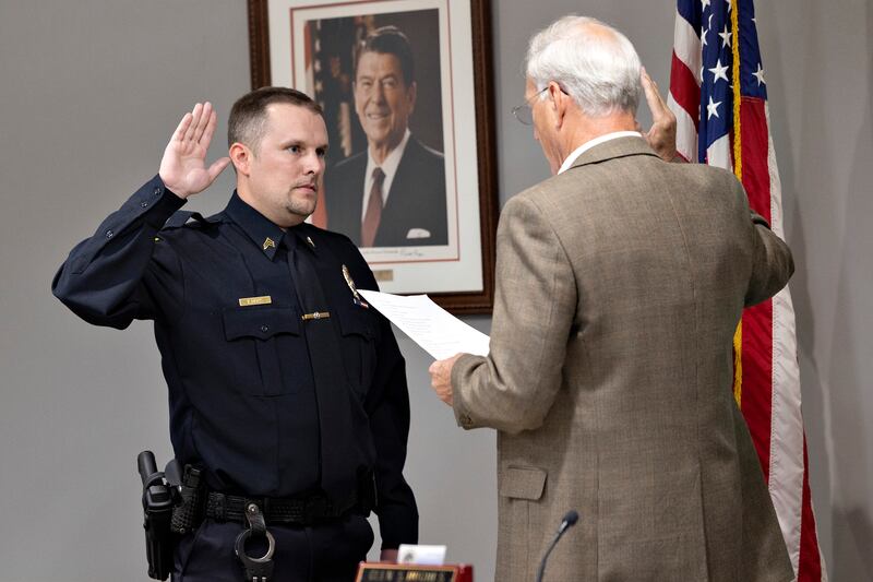 Ed Deets raises his hand to be sworn in as Dixon police’s patrol sergeant Monday, August 18, 2025, by mayor Glen Hughes.