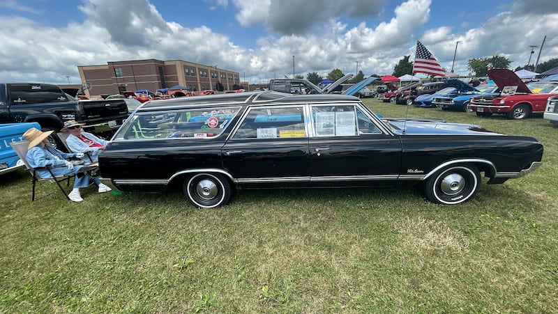 Bill and Joann Wagaman of Rockford sit behind their 1965 Oldsmobile Vista Cruiser station wagon at the 34th Annual Hib Reber Memorial Car Show in Byron on Saturday, July 12, 2025.