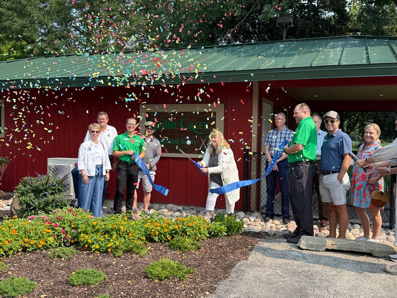 The Geneva Chamber of Commerce celebrating Stone Creek Miniature Golf's new Welcome Hut