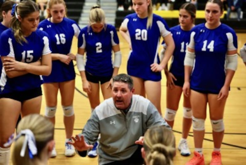 Princeton coach Andy Puck works the huddle in Tuesday's sectional semifinals match against Peoria Notre Dame at Riverdale High School.