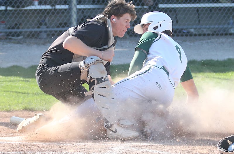 Putnam County catcher Miles Main tags out St. Bede's Gino Ferrari trying to score on Thursday, May 8, 2025 at St. Bede Academy.