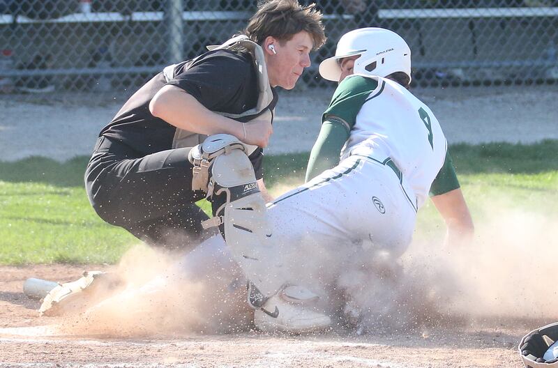 Putnam County catcher Miles Main tags out St. Bede's Gino Ferrari trying to score on Thursday, May 8, 2025 at St. Bede Academy.