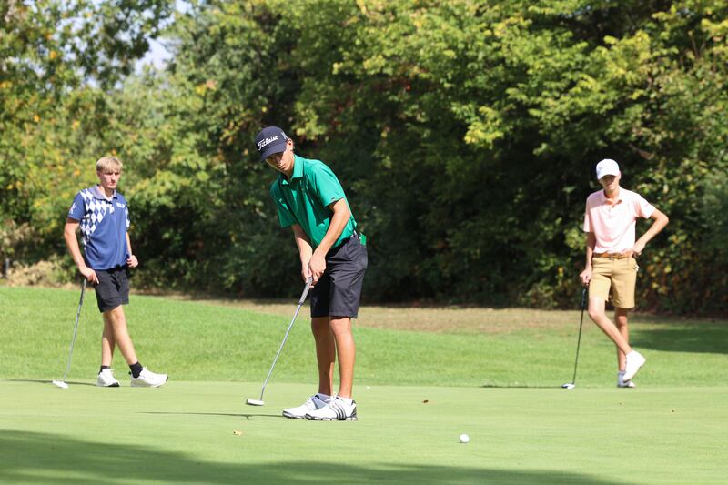 Bishop McNamara's Nolan Andrews watches a putt during the IHSA Class 1A Kankakee (McNamara) Regional at the Kankakee Elks Country Club on Wednesday, Oct. 1, 2025. Andrews would finish in tied for third overall with a score of 82 to help the Fightin' Irish team claim the regional title for the first time since 2010.