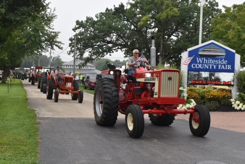 Tractors make their way out of the Whiteside County Fairgrounds in Morrison on Monday, Aug. 11, 2025, for the 2025 tractor ride. After a 40-mile ride, the estimated 70 drivers stopped at Rockwood Park for some ice cream, and then were heading back to the fairgrounds. Ron Shank and his wife, Nancy, were the guides for the ride. The fair begins Tuesday, Aug. 12, and continues through Saturday, Aug. 16.
