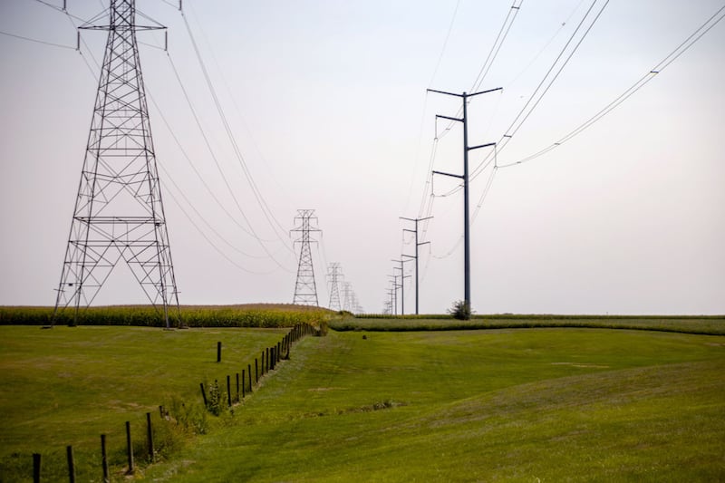 Power lines carry electricity over fields near Glasford.