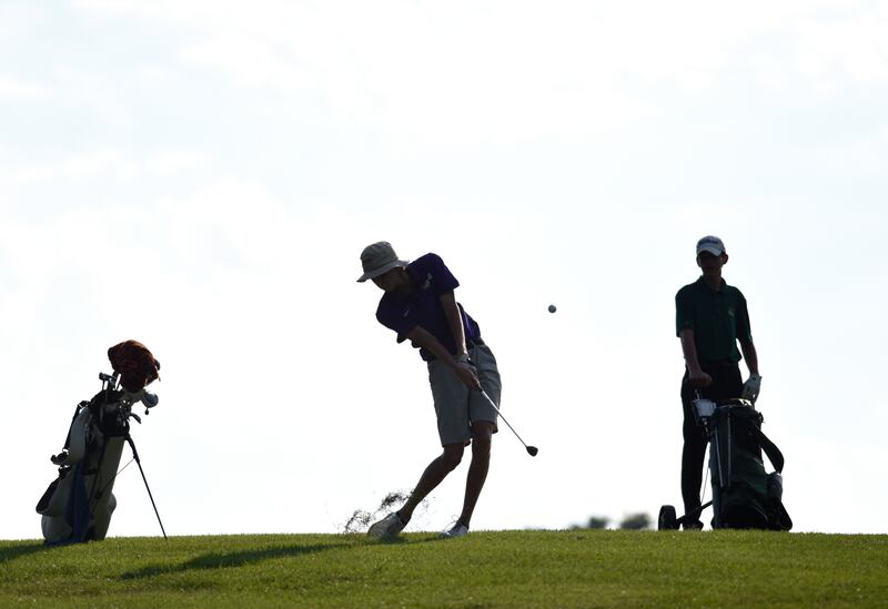Manteno's Landon Bukowski shoots for the green at Minne Monesse Golf Club as Grant Park's Gavin Franke, right, watches on Friday, August 15, 2025.