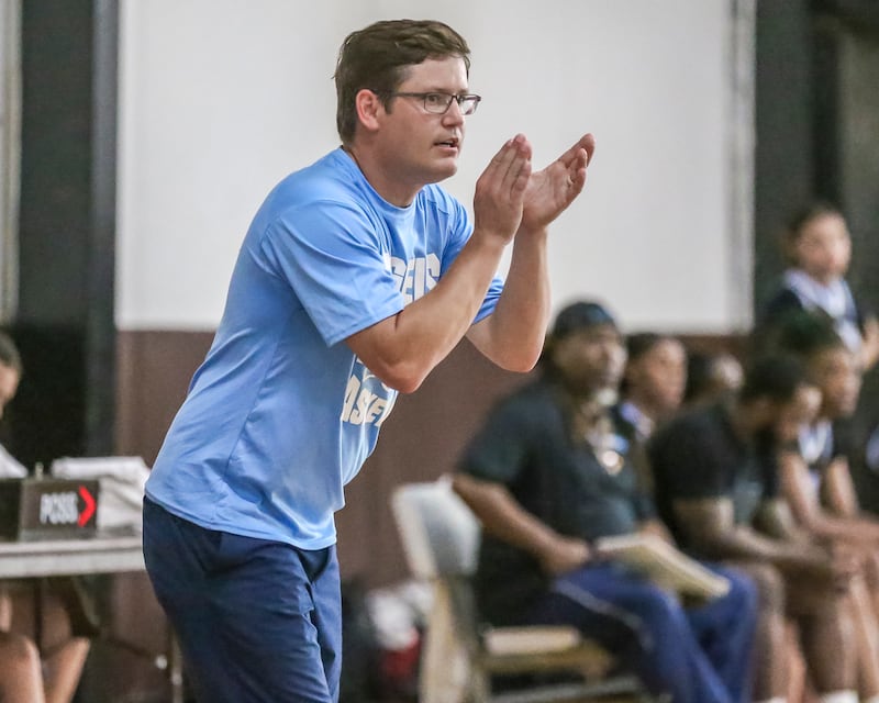 Joliet Catholic's head coach Matt Adler cheers on the team in their Morris Shootout girls basketball game. June 18, 2025 in Morris.