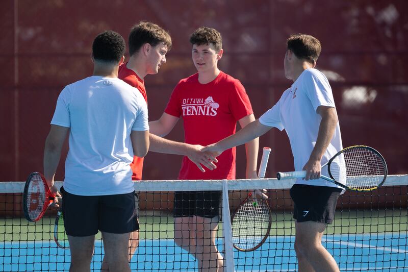 Noah Gross (center left) and Ayden Sexton of Ottawa shake hands with Streator's Devin Thompson and Clayton Lehman (far right) of Streator after their match at No. 1 doubles Monday, May 5, 2025, in Streator.