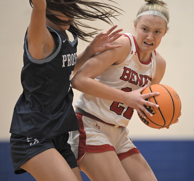 Benet’s Bridget Rifenburg tries to get around Prospect’s Mia Marling in the Exam Jamm girls basketball tournament in Lake Zurich on Tuesday, Dec. 9, 2025.