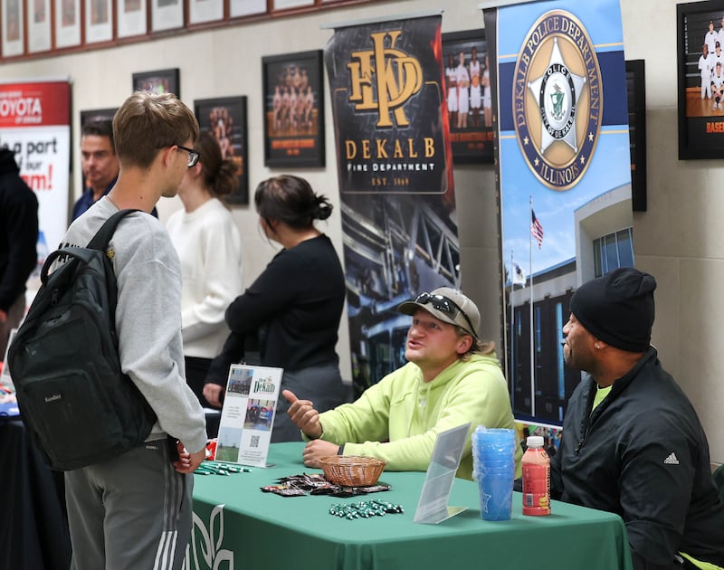 An attendee stops by the City of DeKalb booth Wednesday, Oct. 22, 2025, during Trades Exploration Day at DeKalb High School. The event hosted several companies and organizations that were offering information on opportunities in the trades.
