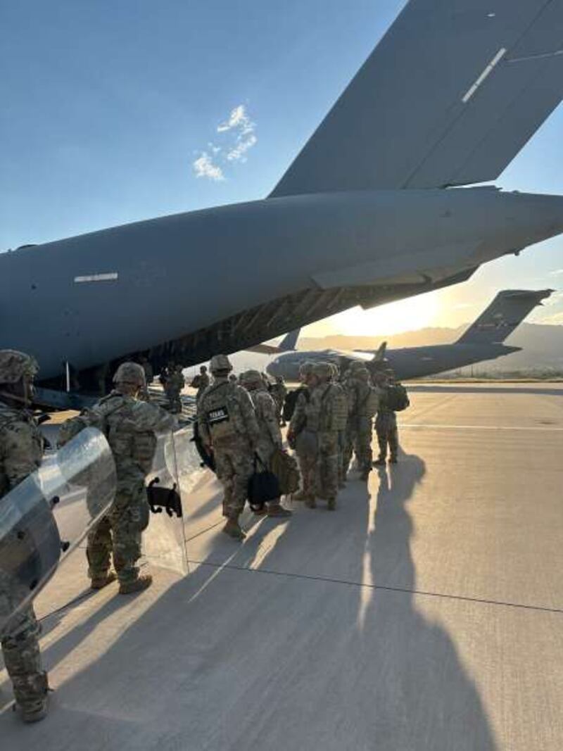 Texas troops boarding a plane bound for Illinois, according to Texas Gov. Greg Abbott's X account.