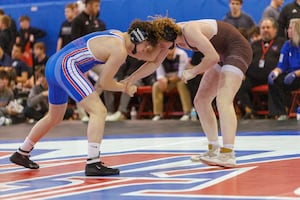 Photos: Marmion, Montini compete at Class 3A dual wrestling sectional