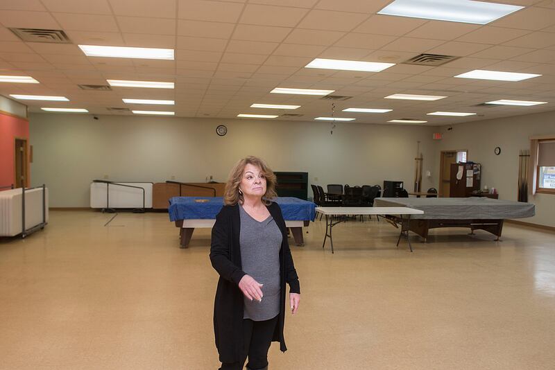 New Whiteside County Senior Center director Susie Welch tours the main room of the center. Pool tables, a craft center and an area for cards will have dividers installed so the noise is lessened a bit.