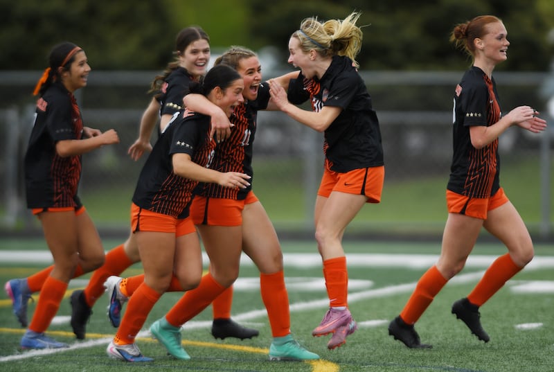 St. Charles East’s Mya Leon flips for a throw-in during the Saints’ Tri-Cities soccer night match against St. Charles North on Tuesday, May 5, 2026 in Batavia.