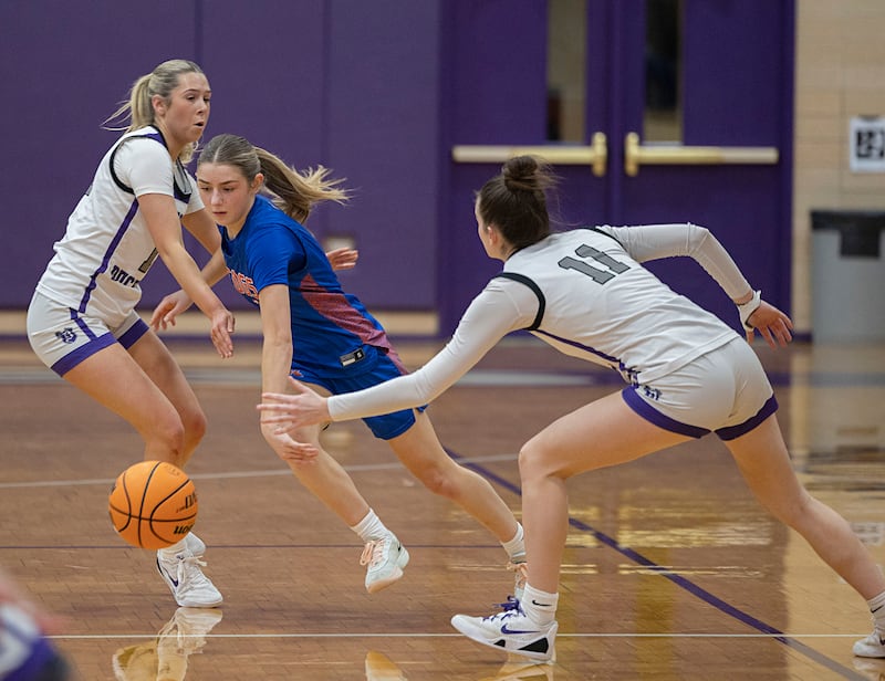 G-K’s Presley Meyer splits a pair of Dixon defenders Tuesday, Jan. 27, 2026.