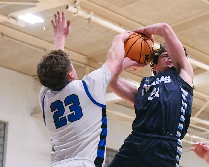 Parkview Christian Academy's Tristian Mersman, right, gets his shot blocked by Hinckley-Big Rock's Luke Badal (23) during the 1A regional championship game on Friday Feb. 27, 2026, held at Hinckley-Big Rock High School.