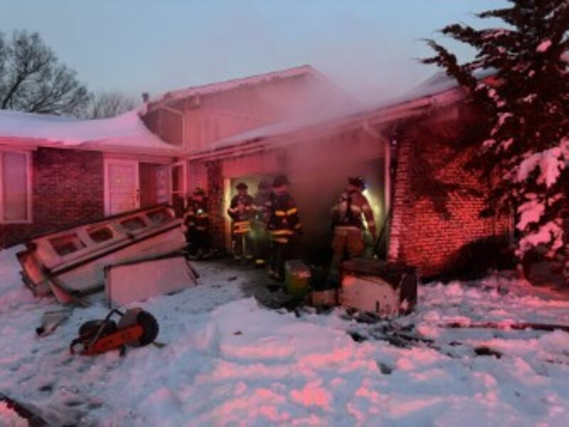 Debris is seen outside of a garage in the 700 block of Westport Drive in Joliet, where a fire broke out early Sunday morning. Nov. 30, 2025