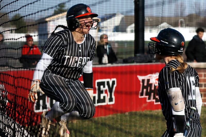 Crystal Lake Central's Adi Waliullah celebrates scoring a run against \h with teammate, Cassidy Murphy, during Fox Valley Conference softball game on Tuesday, April 8, 2025, at Huntley High School.
