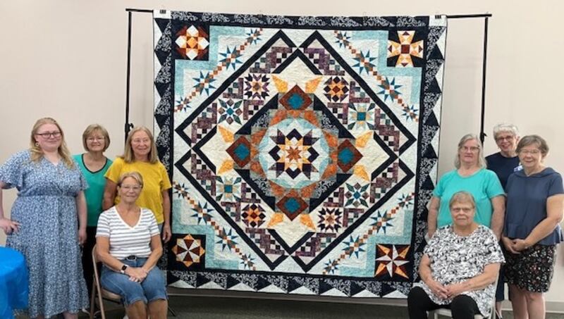 Members of the River Cities Quilters Guild flank the raffle quilt that will be available at the upcoming quilt show in Fulton. Raffle tickets will be available for purchase at the show. The quilt has special significance to the guild because it was started by a member, Sandy Signeri, who died unexpectedly and members finished the quilt in her honor. At the show attendees will find that there are over 100 entries that can be viewed, four area vendors, a bed turning, a quilt appraiser, plus a scissor sharpener on Friday. The quilt show will be from 9 a.m. to 5 p.m. Friday, Sept. 19, and from 9 a.m. to 4 p.m. Saturday, Sept. 20, at the Fulton Presbyterian Church in Fulton. Admission is $5.