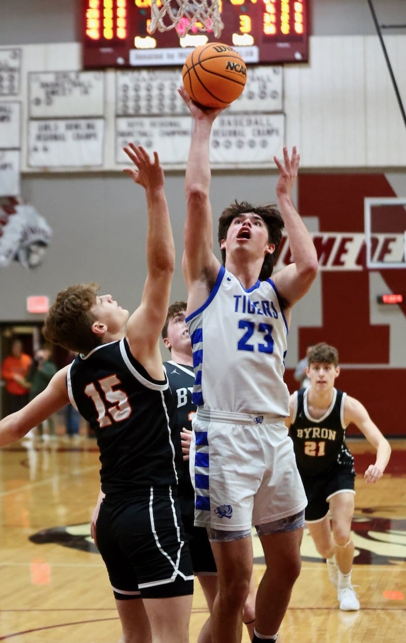 Princeton's Noah LaPorte shoots over Byron's Ben Hively in Wednesday's sectional semifinals at Marengo. Princeton won 46-42 to advance to Friday's championship against Rock Falls.