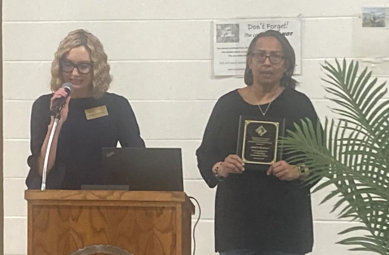 Kristine Schlismann (left), Joliet Township High School District 204’s director of community & alumni relations, presents Joliet NAACP President Judy Easley with the Michael Austin Clark Community Leader Award at the Joliet Township High School District State of the District Award. Thursday, Jan. 29, 2026.