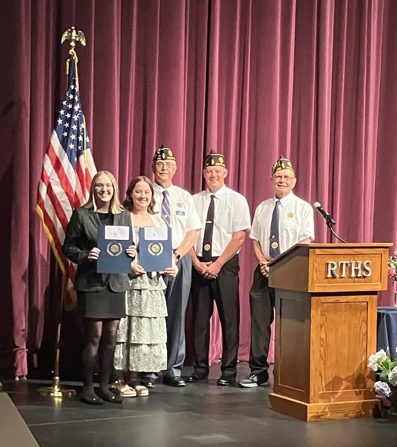 Two scholarships from Arnold Heltness American Legion Post 403 of Rochelle were awarded to students at Rochelle Township High School Honors on May 4. The scholarship winners are (left to right) Hailey Bunger and Alayna Smardo. Also shown (left to right) are Post 403 members Steve Korth (adjutant), Russ Henson (senior vice commander) and Chuck Roberts (commander).