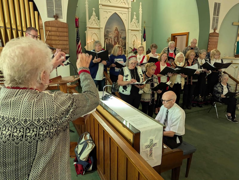 The choir sings and a pianist plays during the Norwegian heritage service on Sunday, Oct. 5.