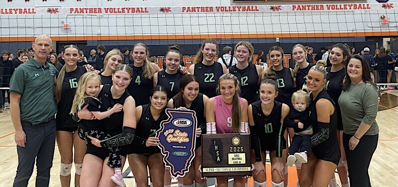 The Providence volleyball team shows off its Class 3A Washington Supersectional trophy after beating the hosts 25-21, 25-18 on Monday.