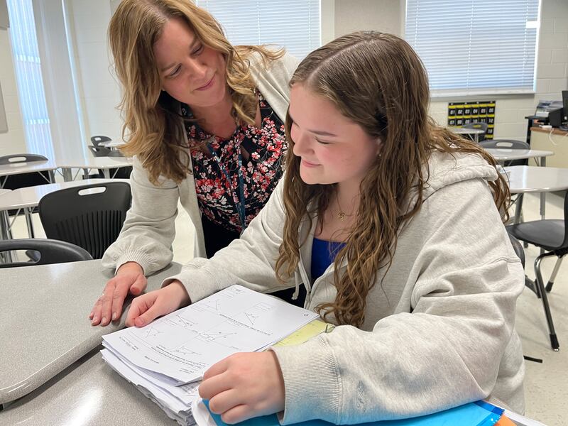 McHenry High School English teacher Heidie Dunn, left, works with sophomore Addison Levine Friday, Feb. 21, 2025 at McHenry High School Upper Campus. Dunn is nominated for the Illinois State Teacher of the Year.