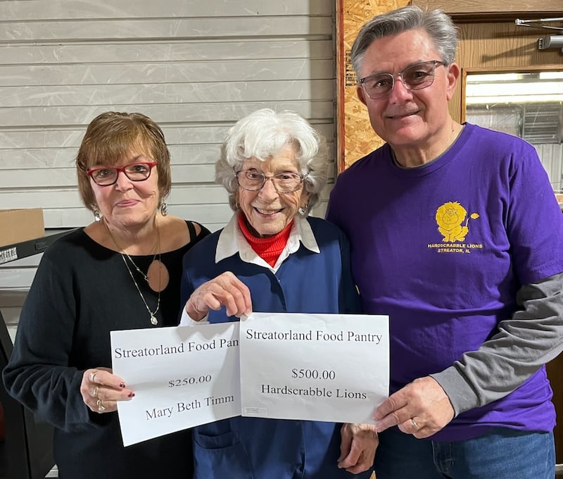 Hardscrabble Lions Club raffle winner Mary Beth Timm (from left), Streatorland Food Pantry president Bertie Beckman, and Hardscrabble Lions Club Ed Mollo