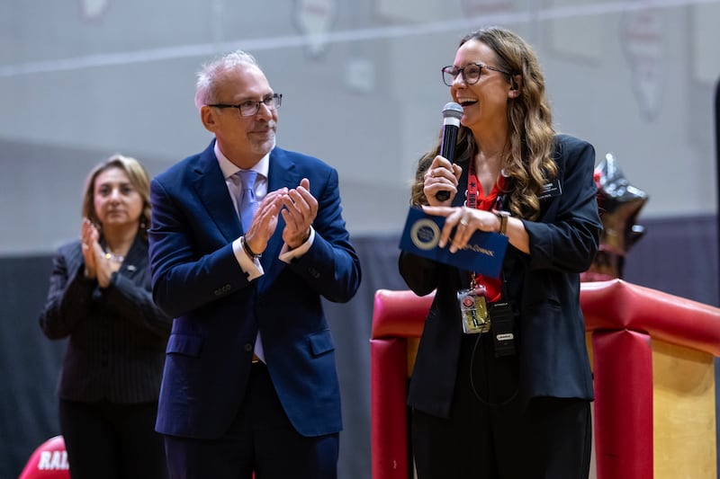 Dr. Jaclyn Lennox, Bolingbrook High School’s assistant principal of curriculum and instruction, thanks her colleagues, students, and everyone who supports the school after winning the Milken Educator Award during a surprise assembly at Bolingbrook High School on Oct. 16, 2025.