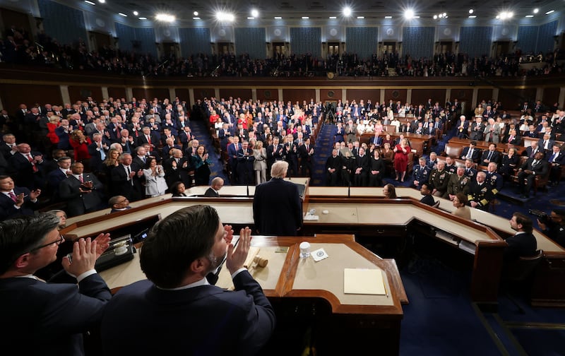 Members of the Congress give a standing ovation as President Donald Trump delivers the State of the Union address to a joint session of Congress in the House chamber at the U.S. Capitol in Washington, Tuesday, Feb. 24, 2026. (Jessica Koscielniak/Pool Photo via AP)