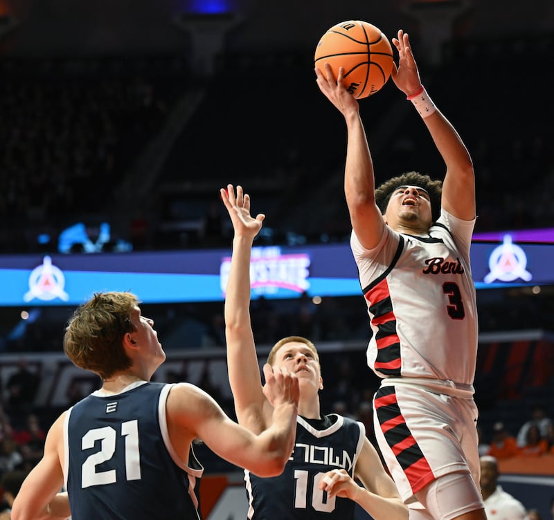 Benet Academy's Jayden Wright, right, goes to the basket against Evanston's Ben Ojala, middle, and Vito Rocca during the IHSA Class 4A boys basketball state semifinals at State Farm Center on Friday, March 14, 2025 in Champaign.
