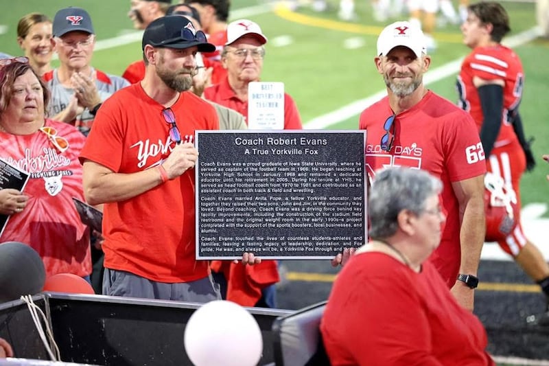 Robert Evans' sons were presented with the "Legend Award" at the Oct. 3 football game at Yorkville High School. Evans is the first recipient of the award.