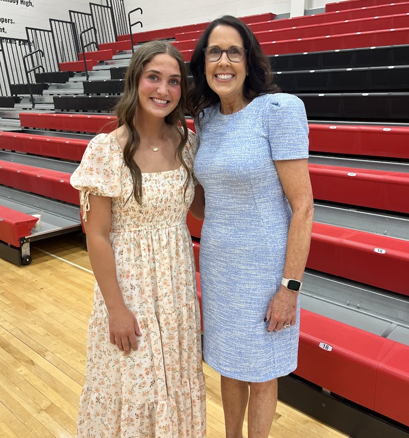 Amboy High School senior Ellie McLaughin (left) was named Student of the Year during the high school's honors night. She is pictured with Colleen Henkel, president of The First National Bank in Amboy, which sponsors the award and its $5,000 scholarship.