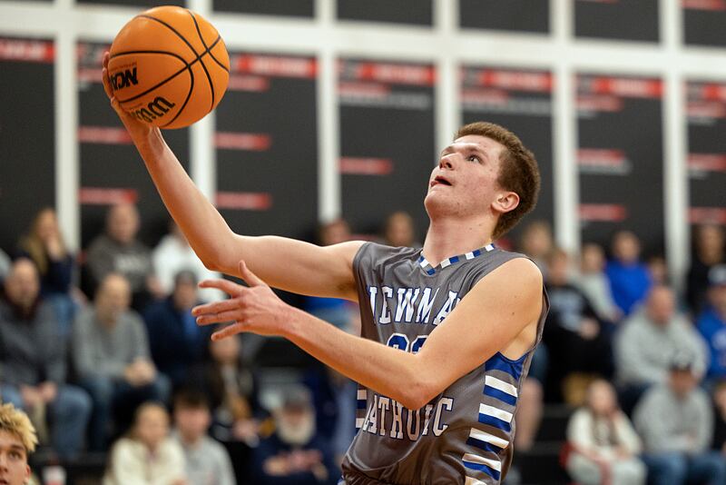Newman’s John Rowzee puts in a bucket against Riverdale Tuesday, Dec. 30, 2025, in the final of the boys Cliff Warkins Basketball Tournament at Erie High School.