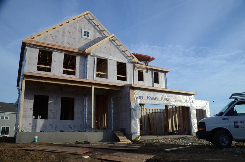 A new home under constructions stands in the Grande Reserve subdivision in Yorkville, Nov. 19, 2020.