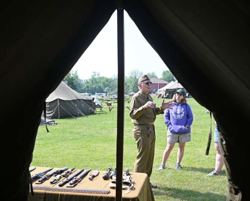 Len Brunkalla of Elgin tells guests stories from the American soldier’s perspective Sunday during the Rails to Victory World War II reenactment event at the Fox River Trolley Museum in South Elgin.