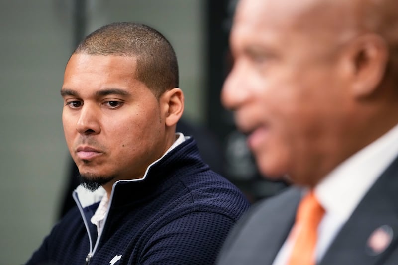 Chicago Bears General Manager Ryan Poles, left, listens as President and CEO Kevin Warren speaks during an NFL football news conference at Halas Hall in Lake Forest, Ill., Monday, Dec. 2, 2024. (AP Photo/Nam Y. Huh)